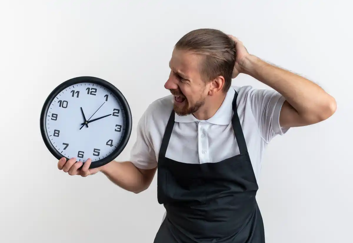 frustrated person looking at clock busy time management