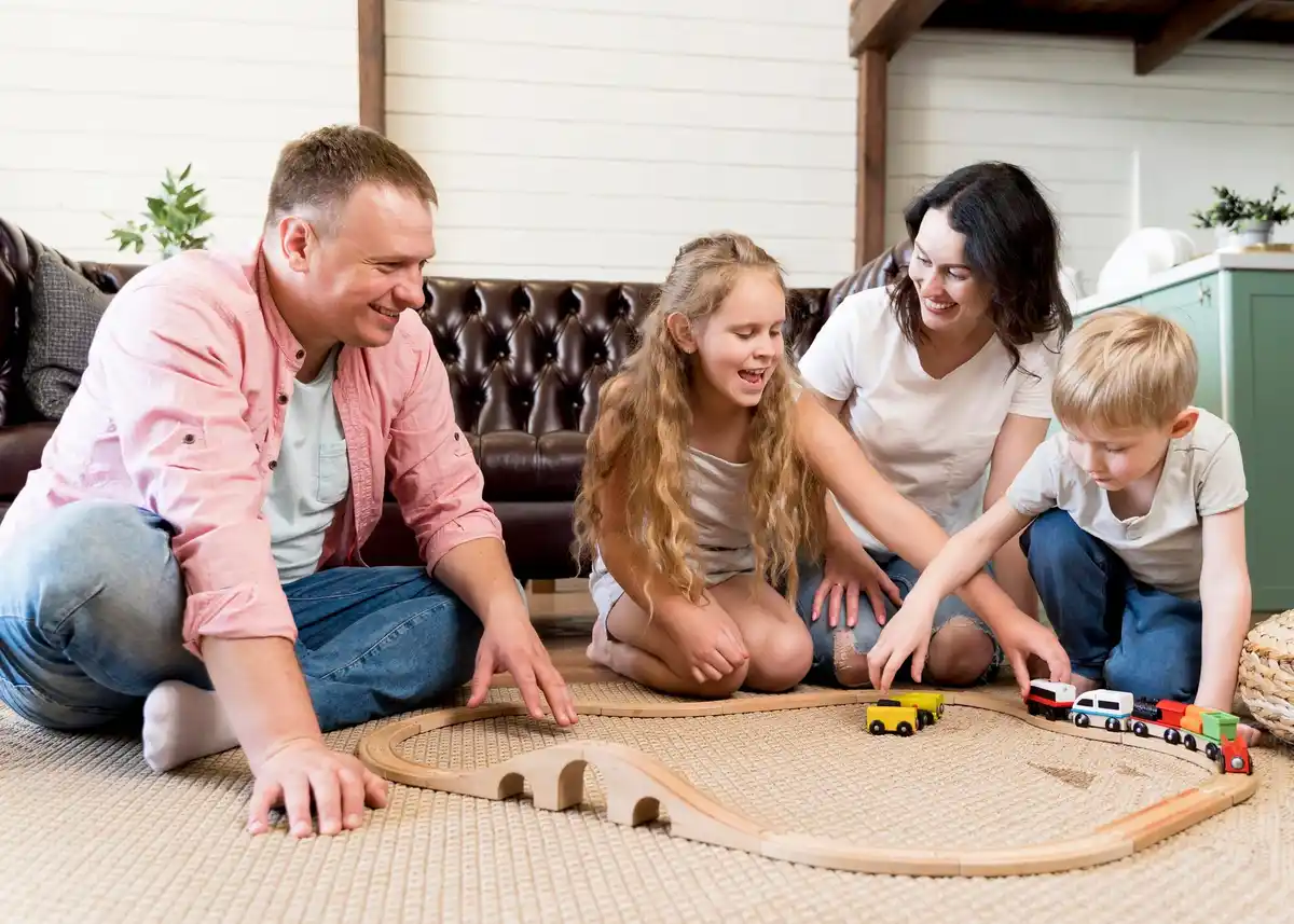 family playing board game cozy home