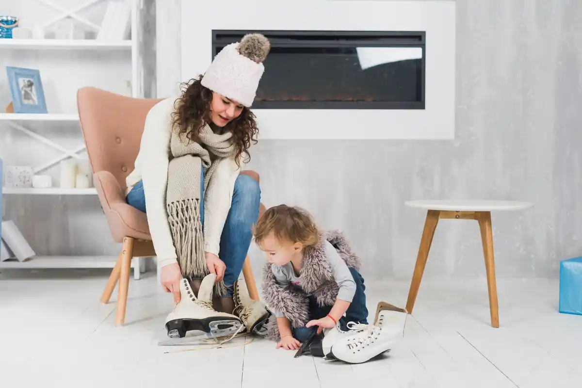 family tidying up living room with kids playful
