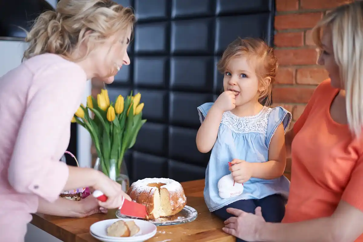 parents and children having heart-to-heart talk at dining table