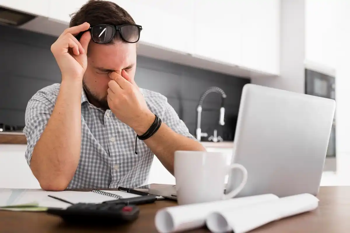 tired person multitasking office frustrated