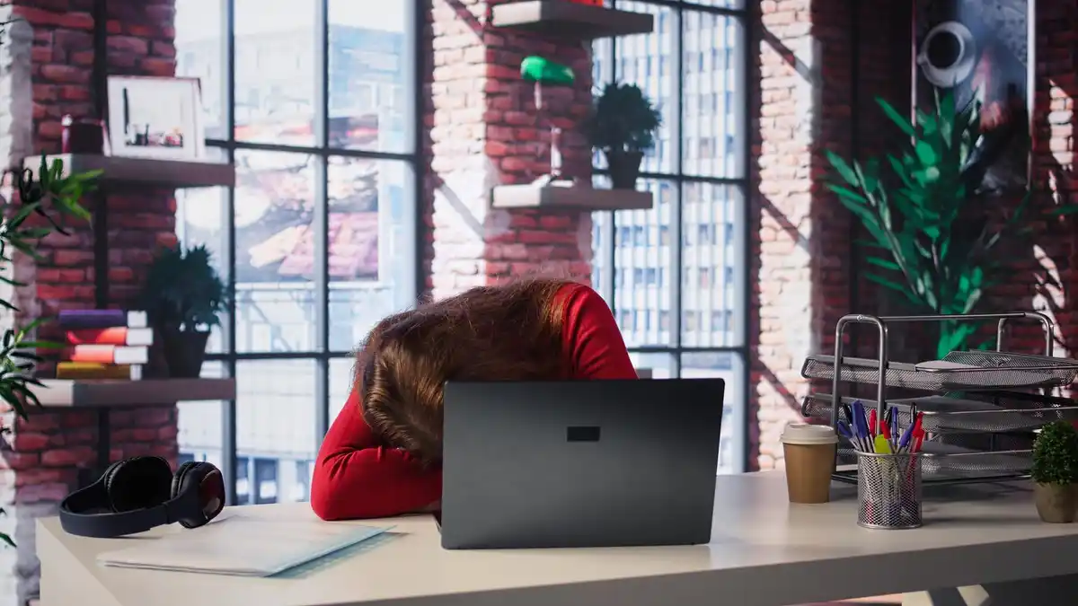 busy office worker tired desk computer