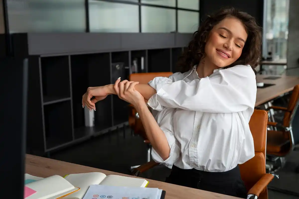 person doing stretches at desk
