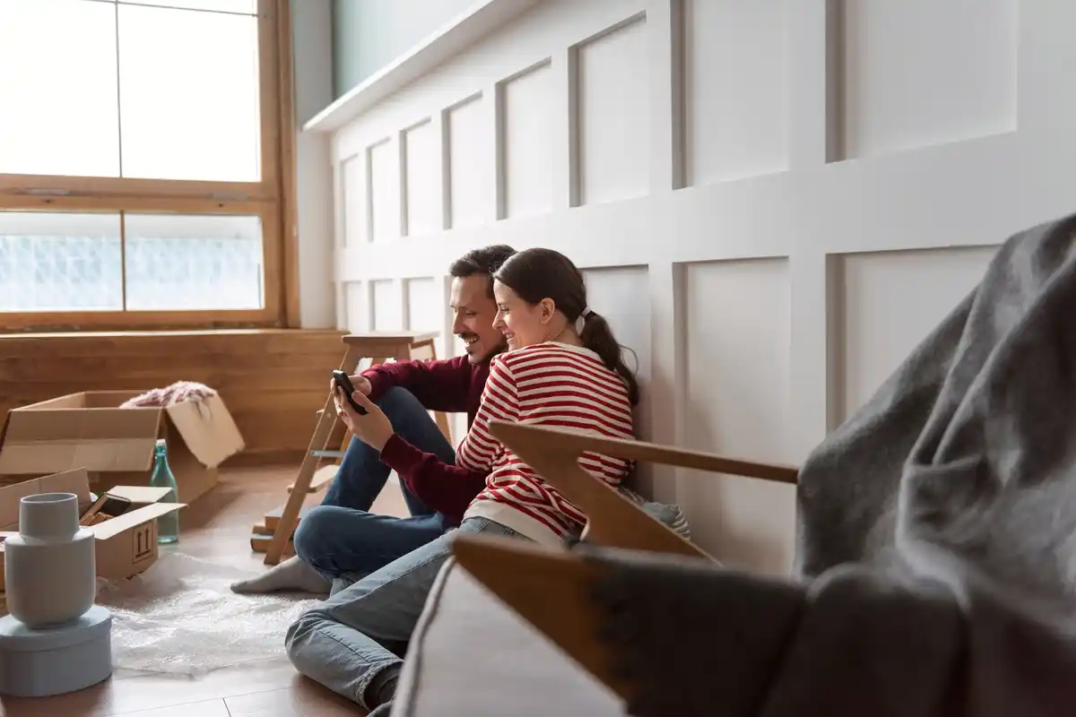 happy roommates laughing in cozy Dutch apartment