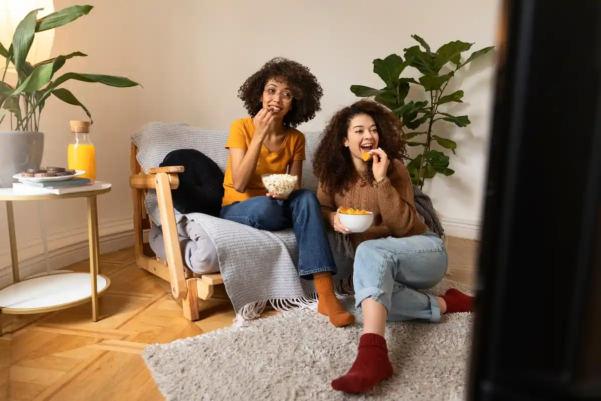cozy living room with housemates laughing together