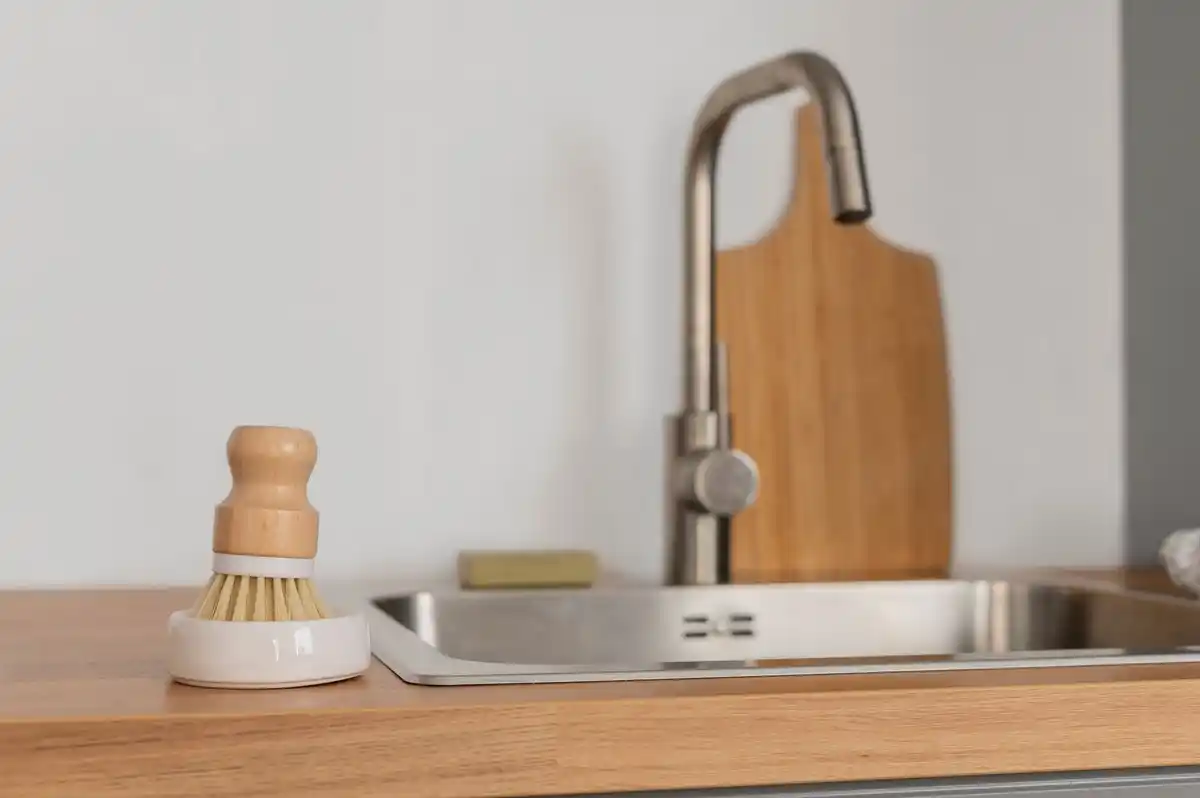 clean kitchen sink with natural cleaning products