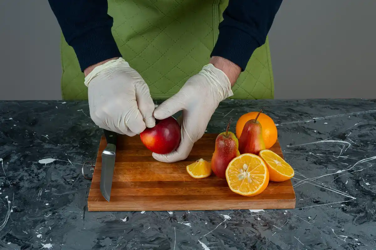 chef using claw grip technique to cut vegetables safely