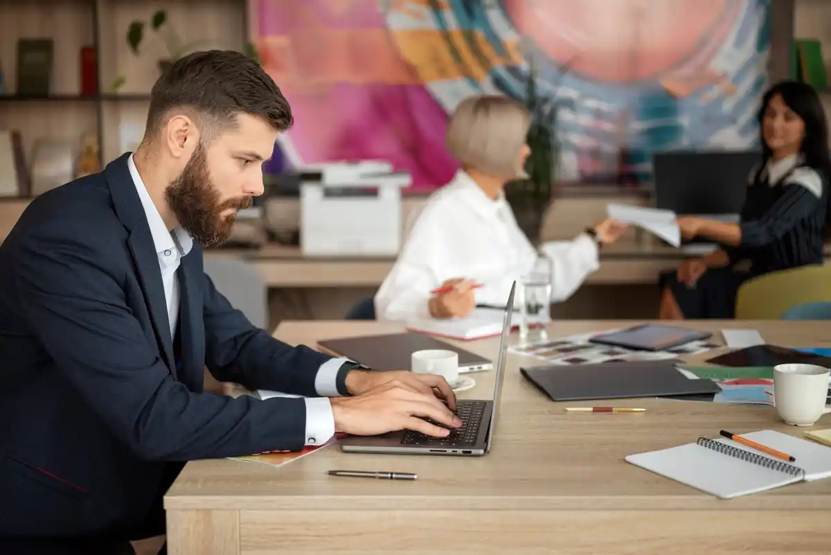 focused professional working single task laptop office