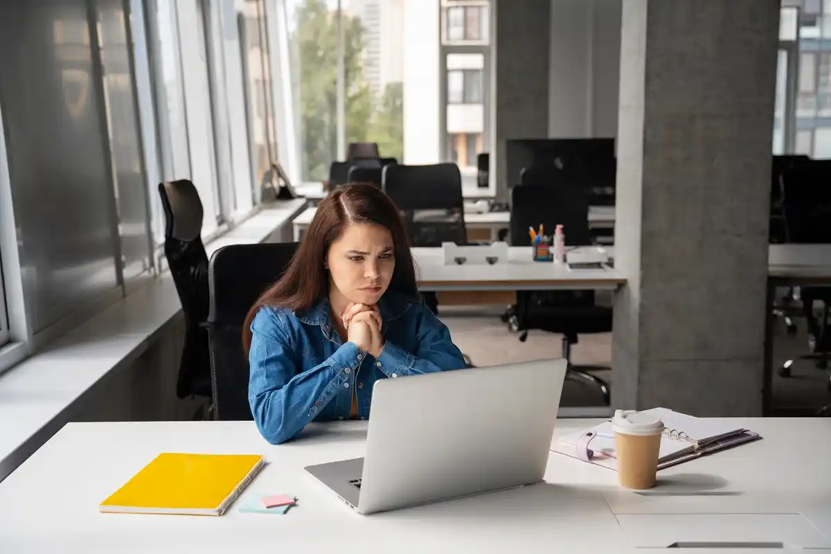 focused person working productivity office laptop