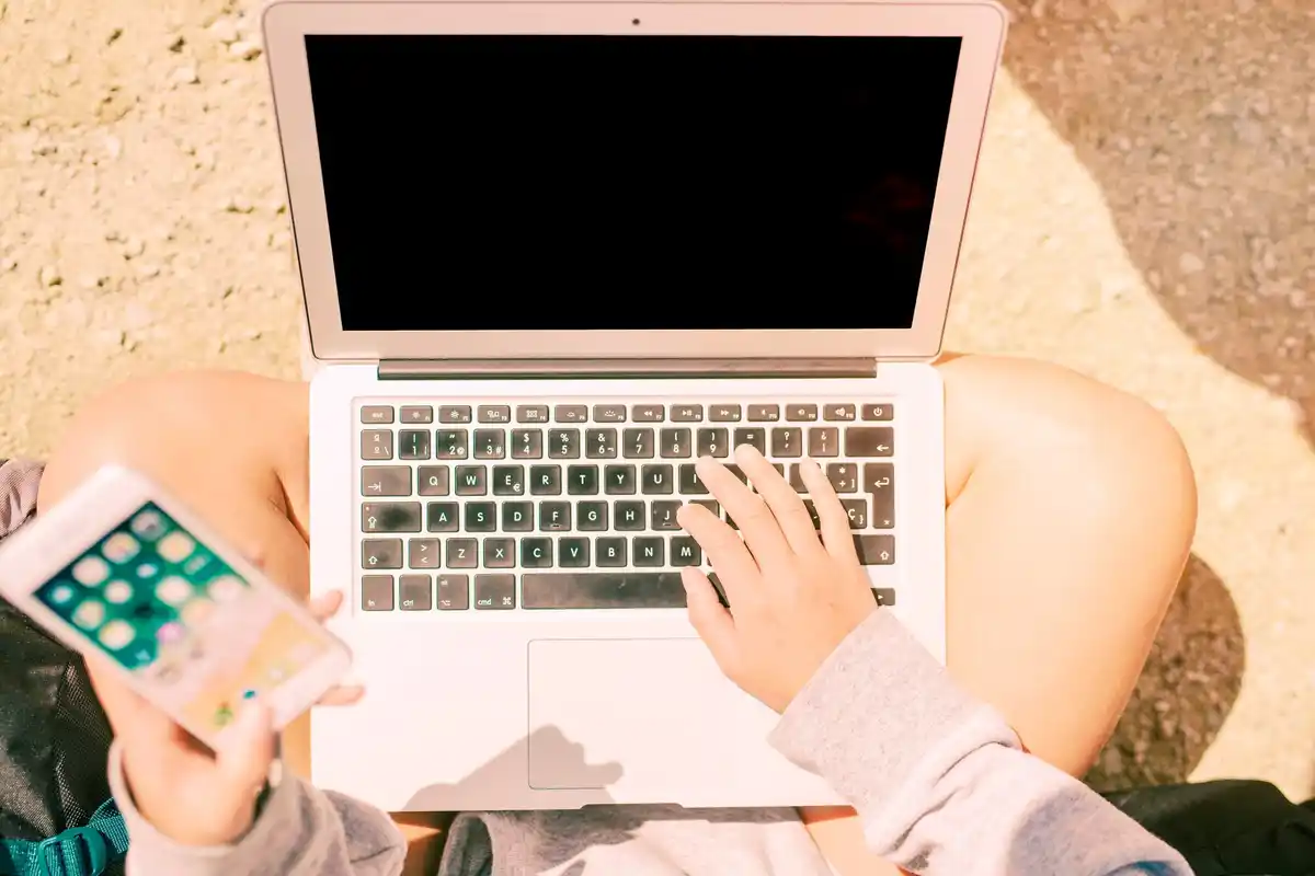 person using VPN laptop travel booking