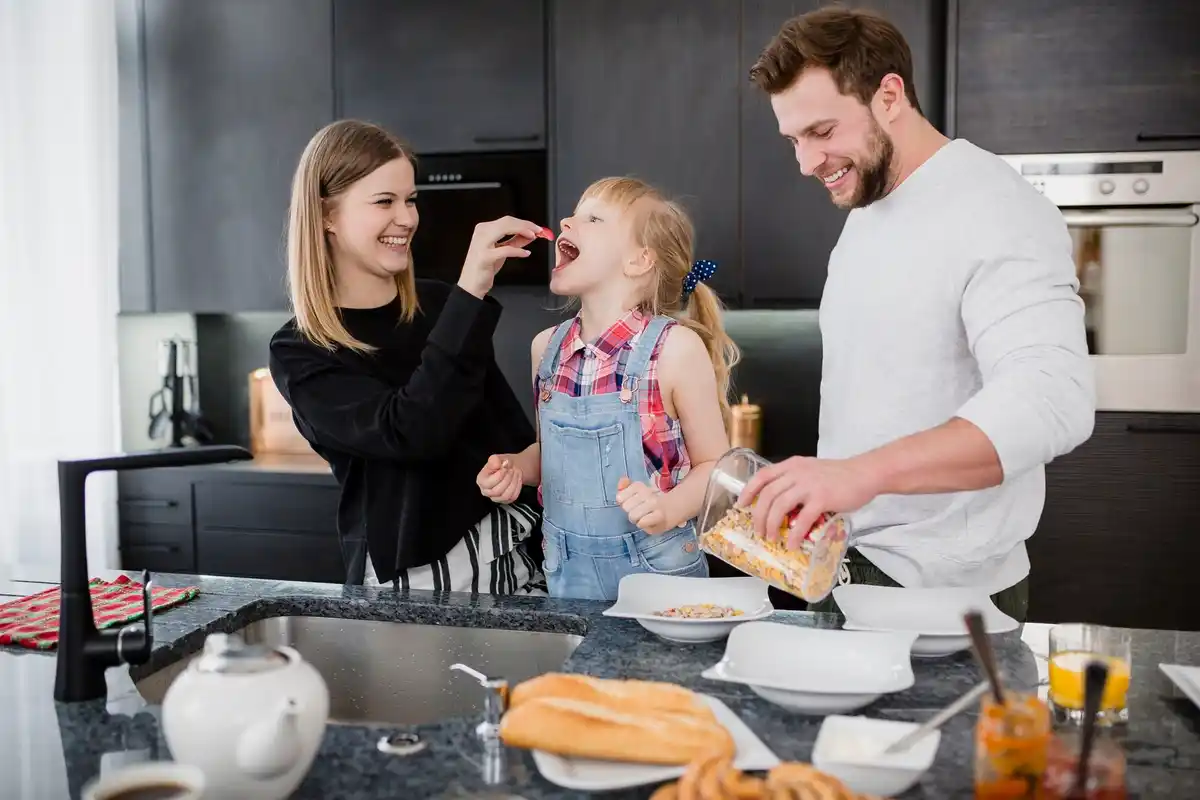 Dutch family sharing household chores smiling