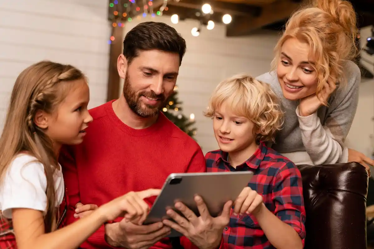 family using digital planner on tablet
