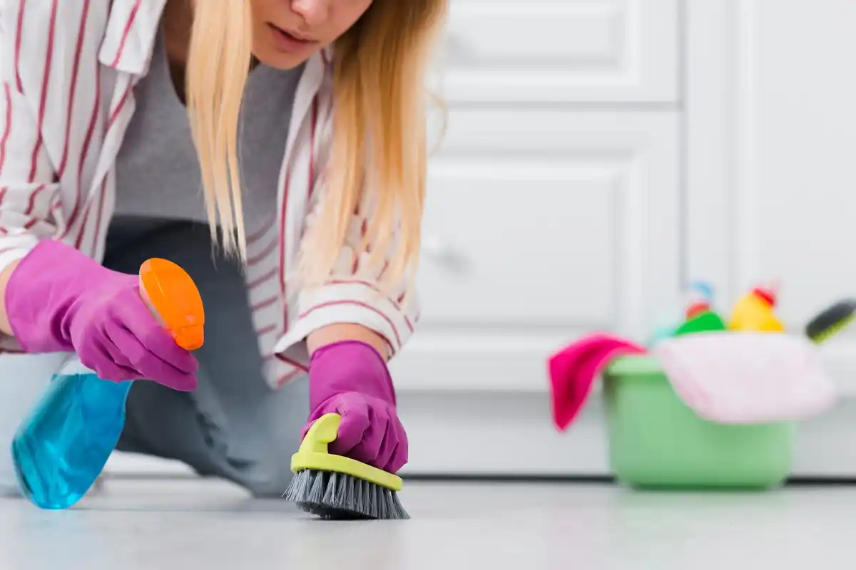 spot cleaning wooden floor with microfiber cloth