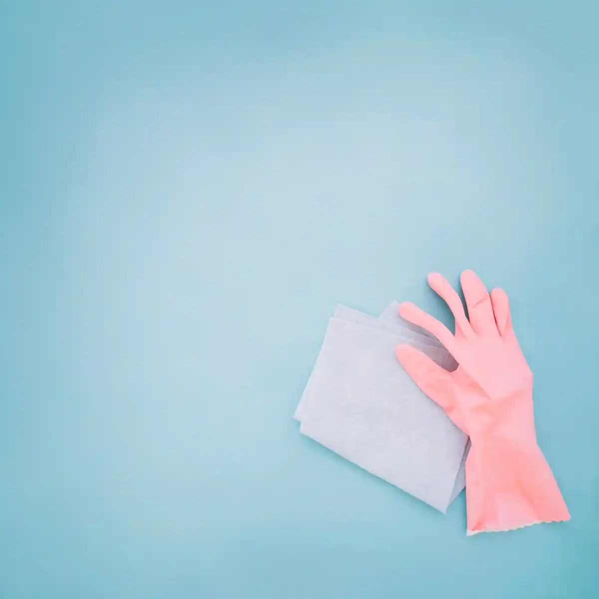 hand cleaning kitchen counter with microfiber cloth