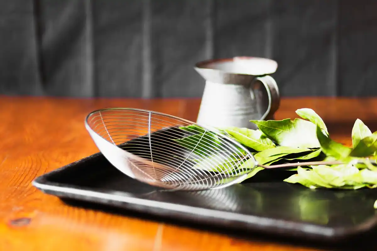 straining kitchen sieve with coffee filter