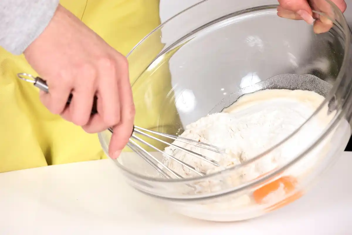 kitchen mixer kneading soft dough in bowl