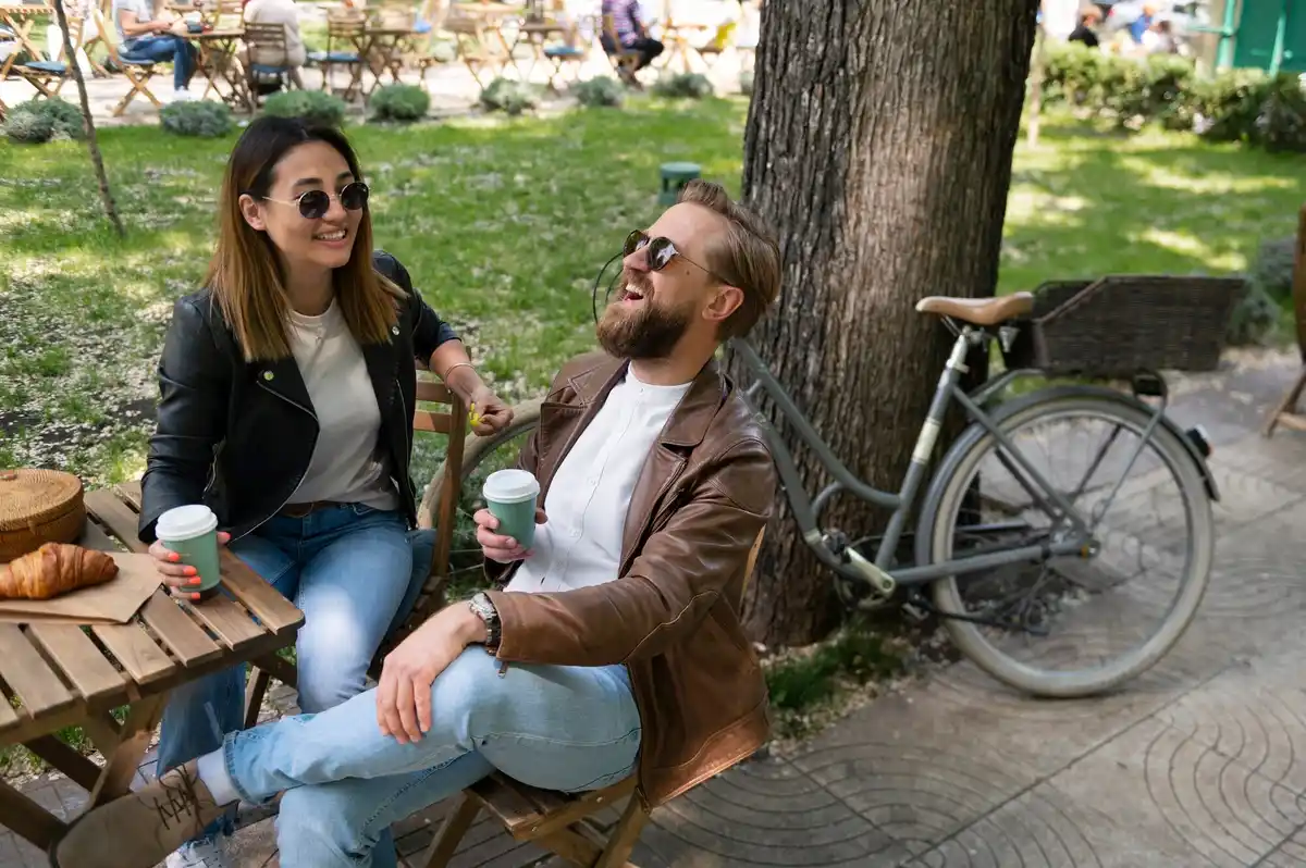people relaxing in a park in amsterdam