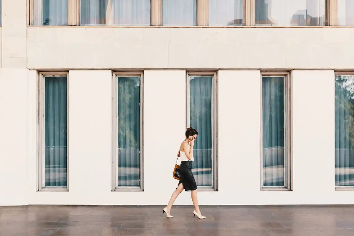person taking a short walk outside office building