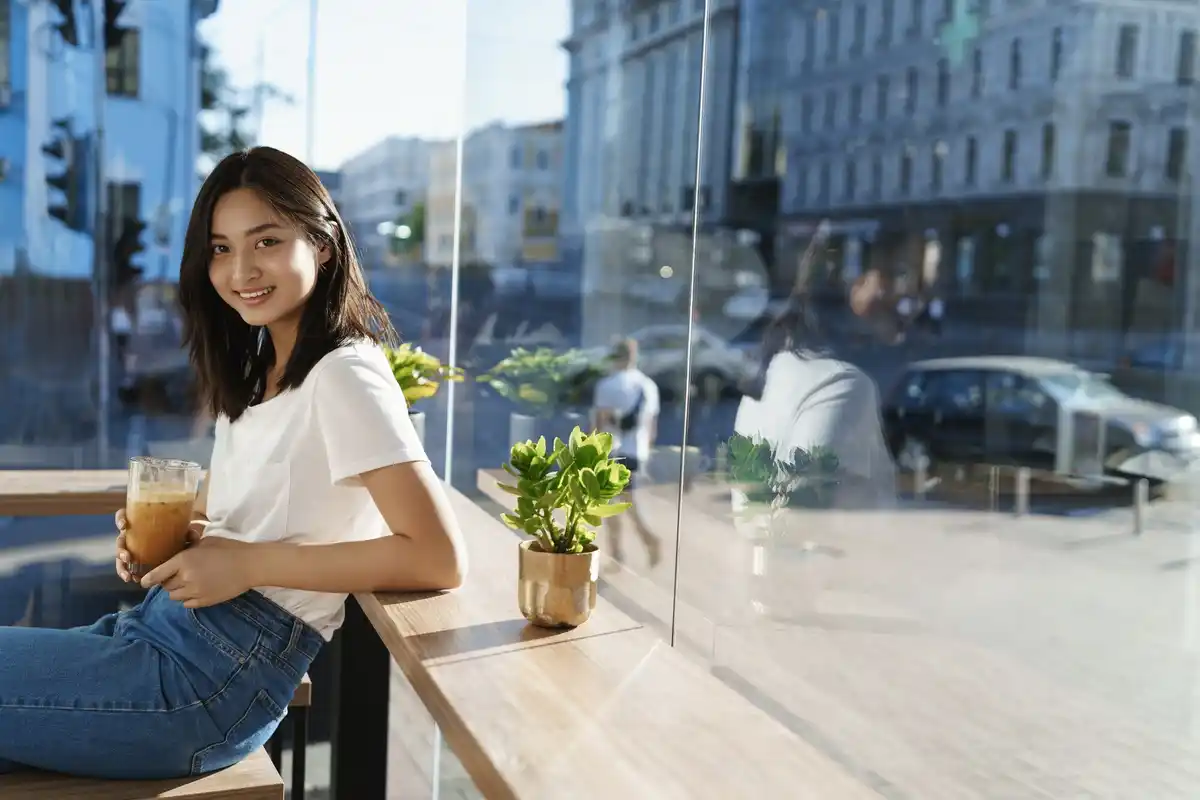 happy relaxed traveler enjoying local cafe