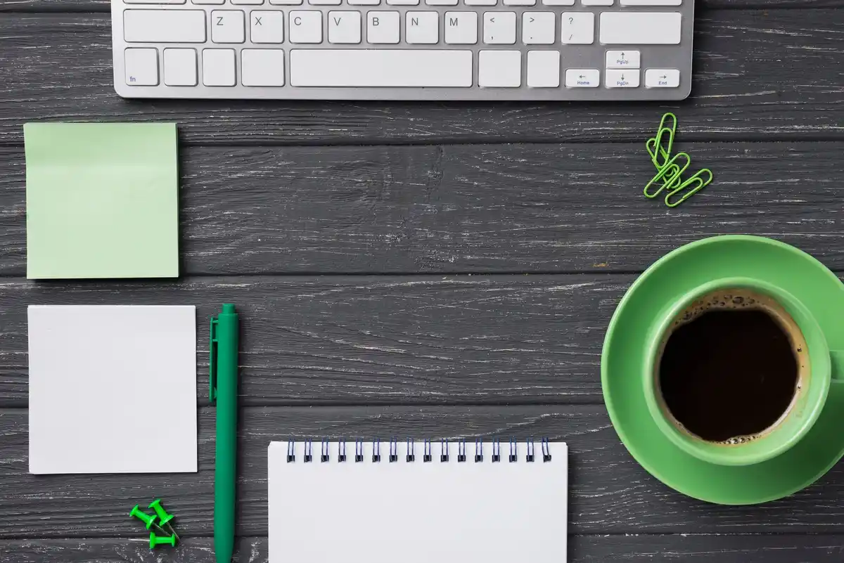 focused working desk with coffee and notebook