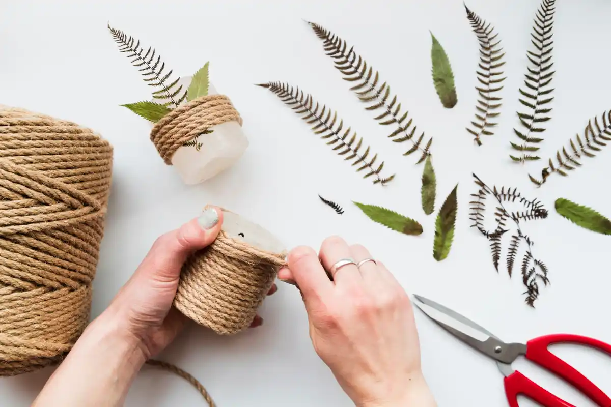 Close-up of creative crafting with recycled materials on a wooden table