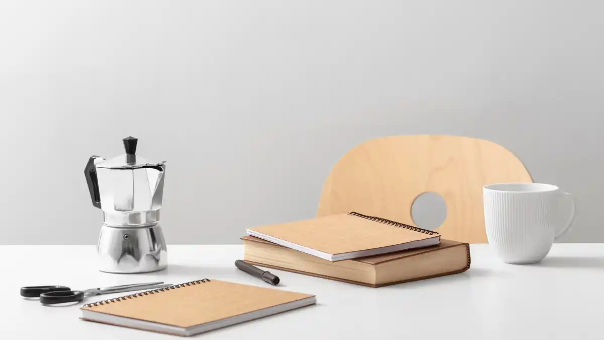 creative workspace with coffee and notebook