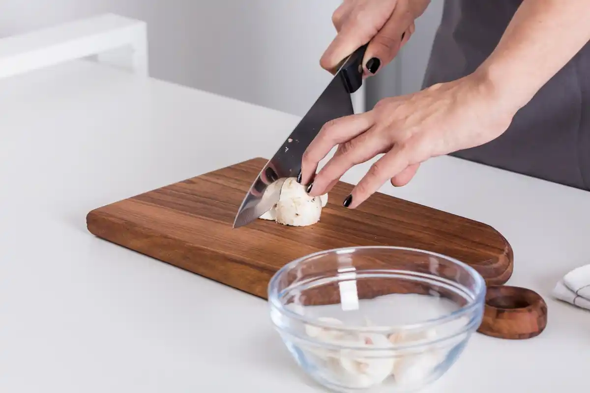 cutting onion with ice water bowl