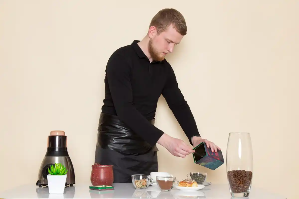 barista adding pinch of salt to coffee grounds