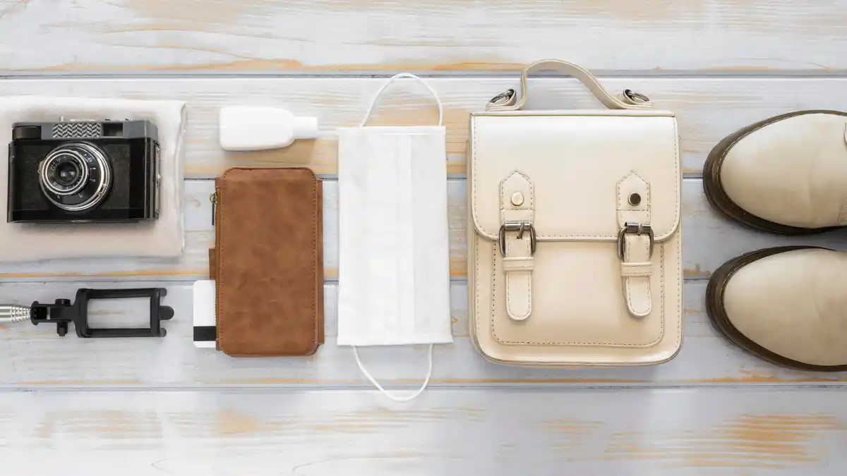 travel essentials organised suitcase flat lay