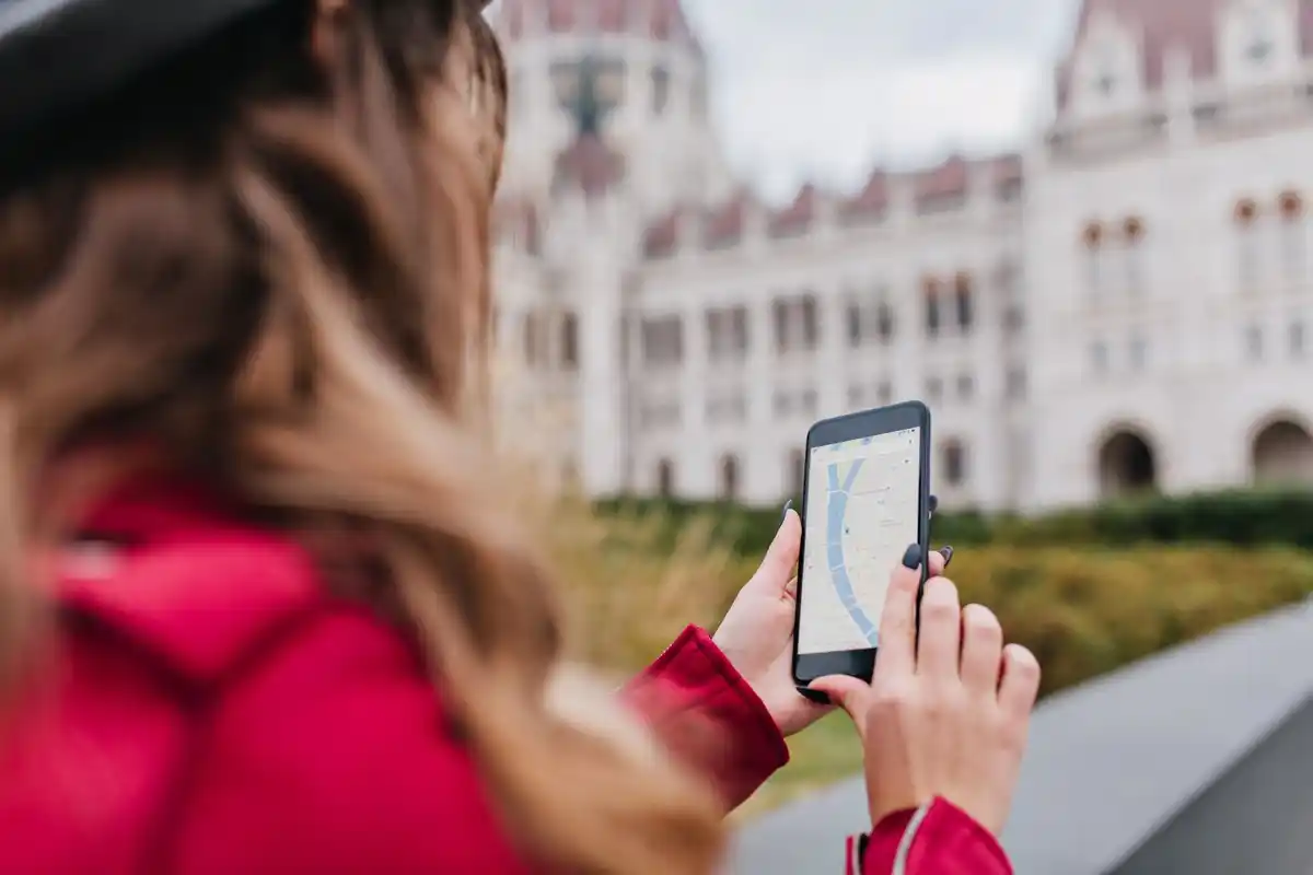 smartphone open with travel app navigation maps
