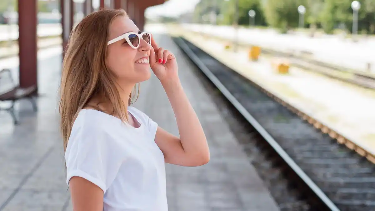 stress-free Dutch traveler relaxing at train station