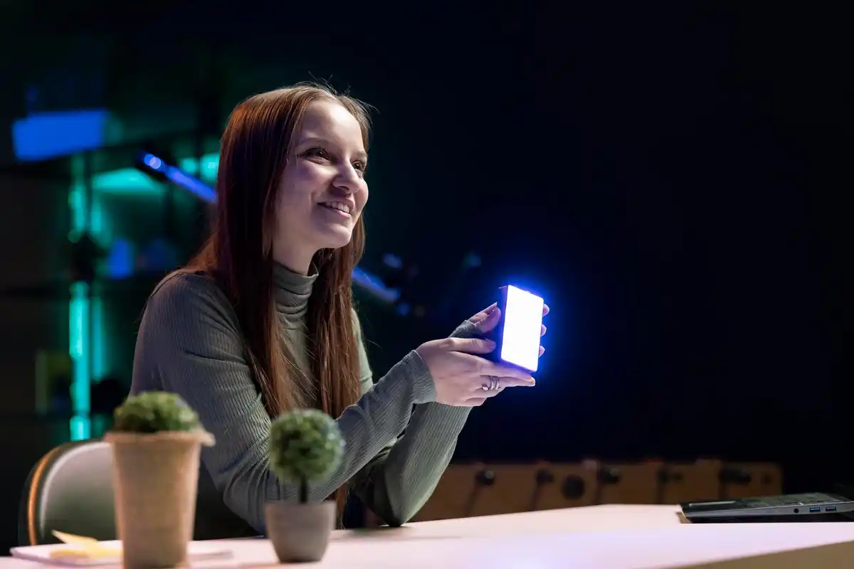 person resetting smartphone with data backup visible