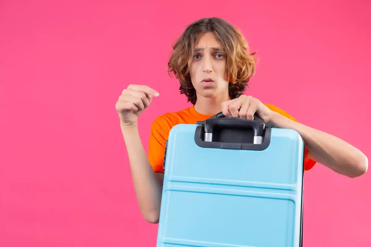 overpacked suitcase travel mistake airport