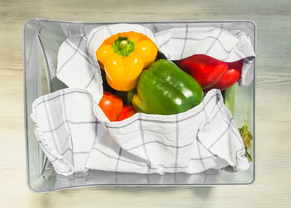 vegetables wrapped in damp paper towel inside plastic bag