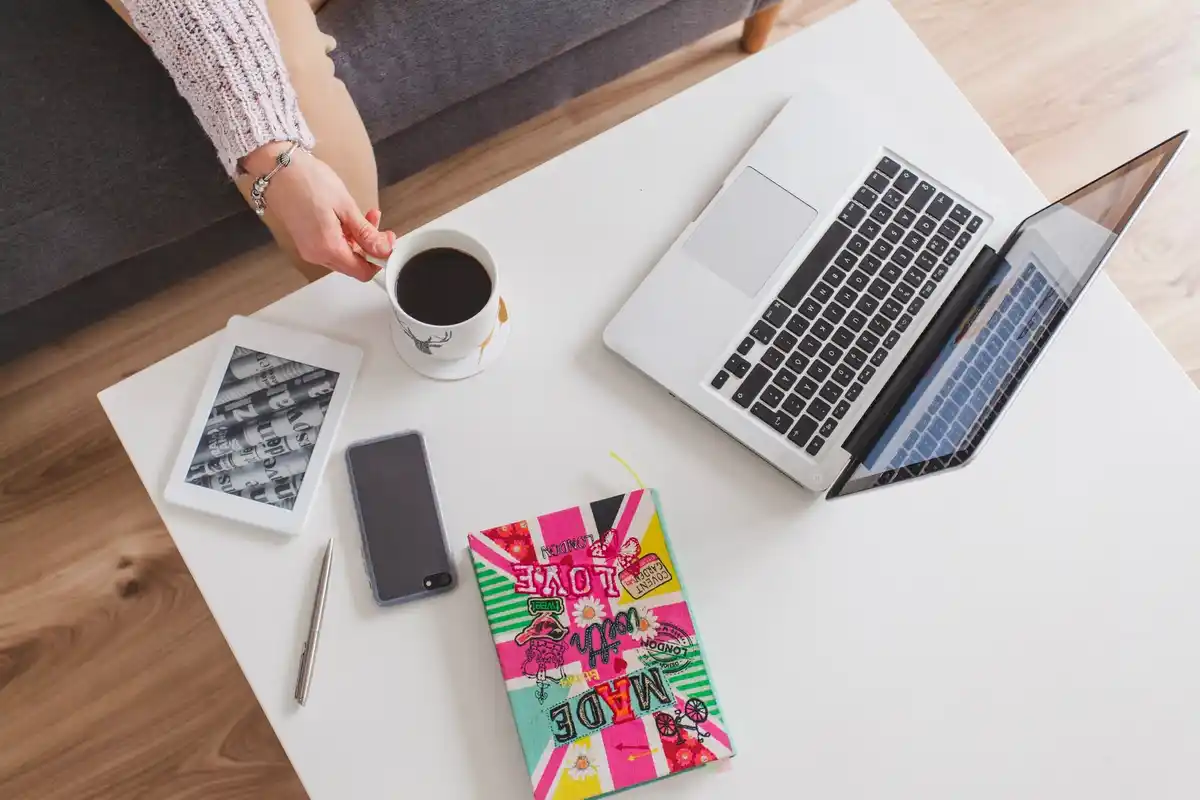 productive work hacks busy office desk laptop coffee
