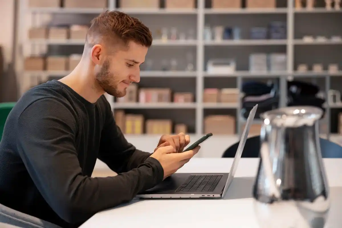 person working with phone turned off on the desk