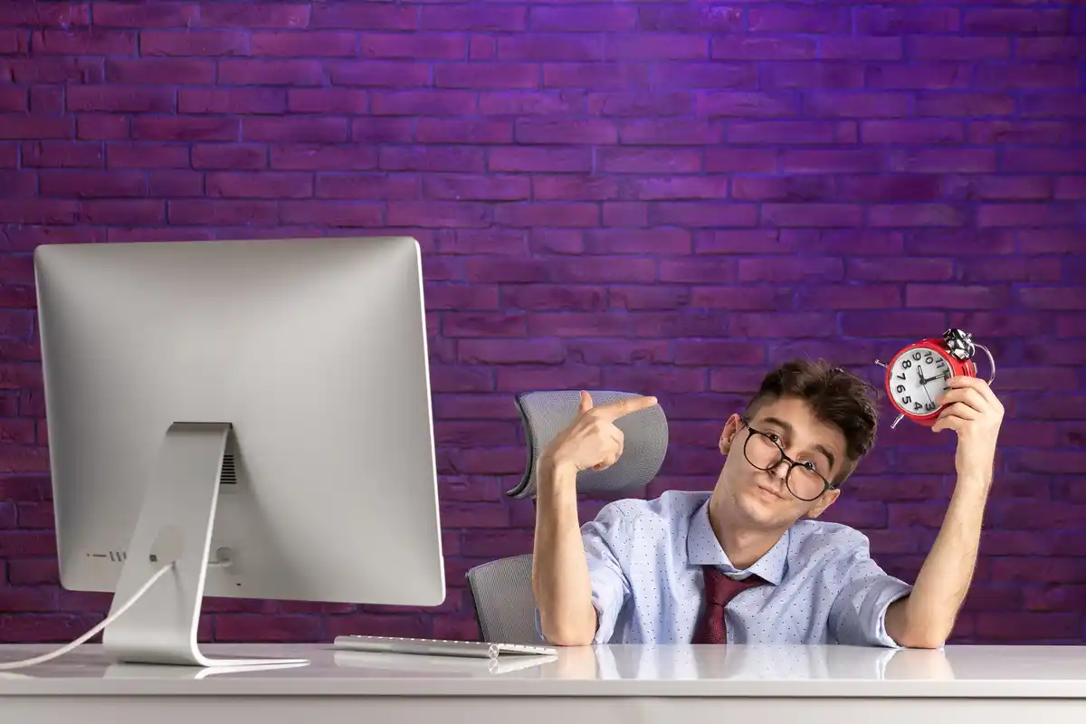 frustrated office worker multitasking clock