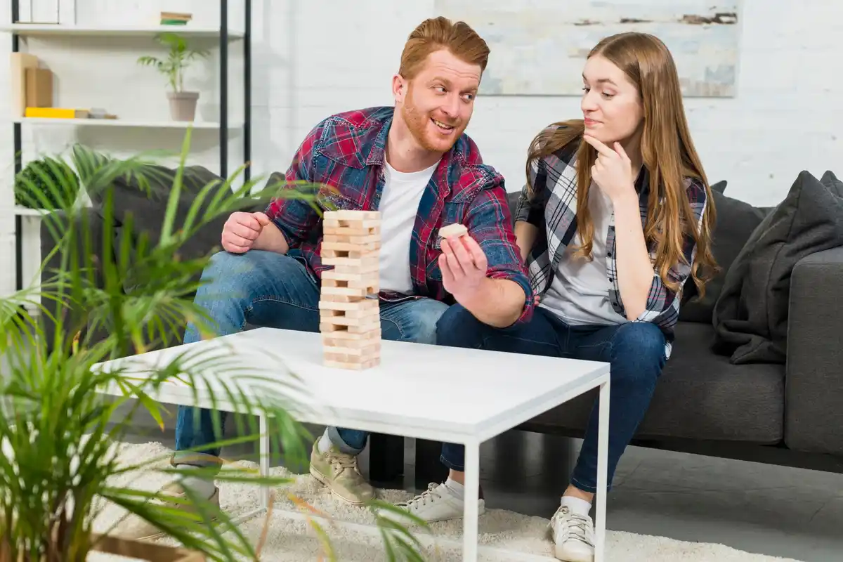 family playing board game together indoors