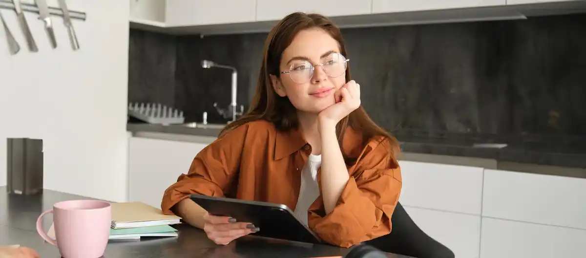 bright focused person working at desk
