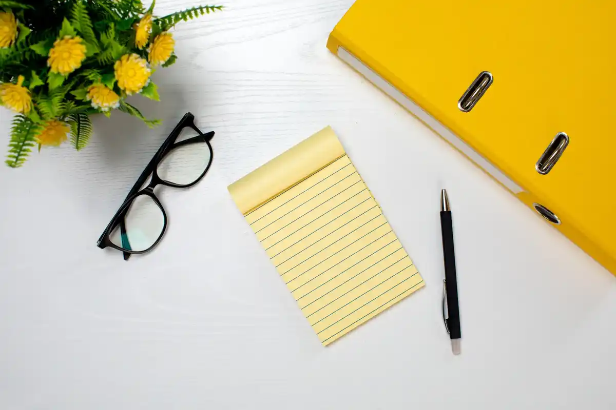 priority list with sticky notes and pen on office desk