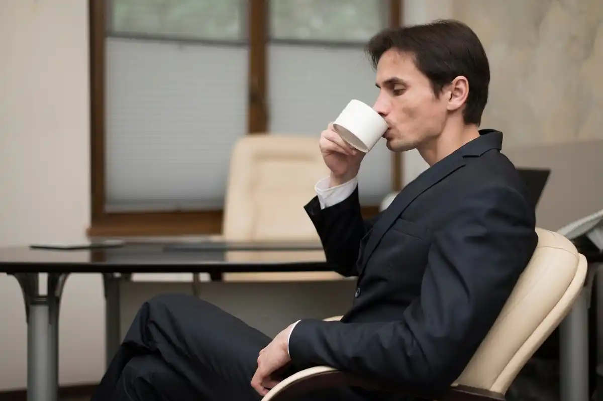 person taking a break at work, relaxed and thoughtful
