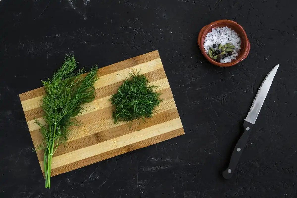 fresh herbs and spices on wooden board