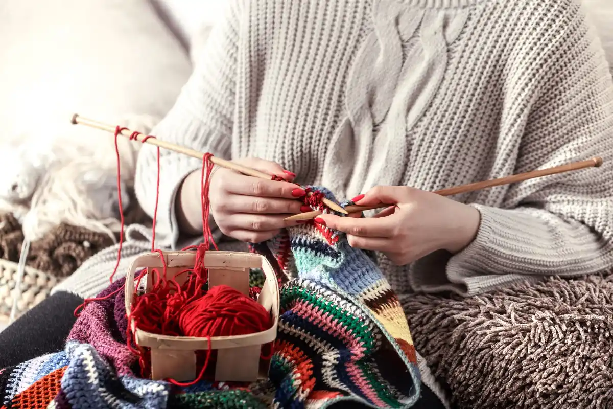 young people knitting and crocheting in the Netherlands, colorful yarn and hands at work