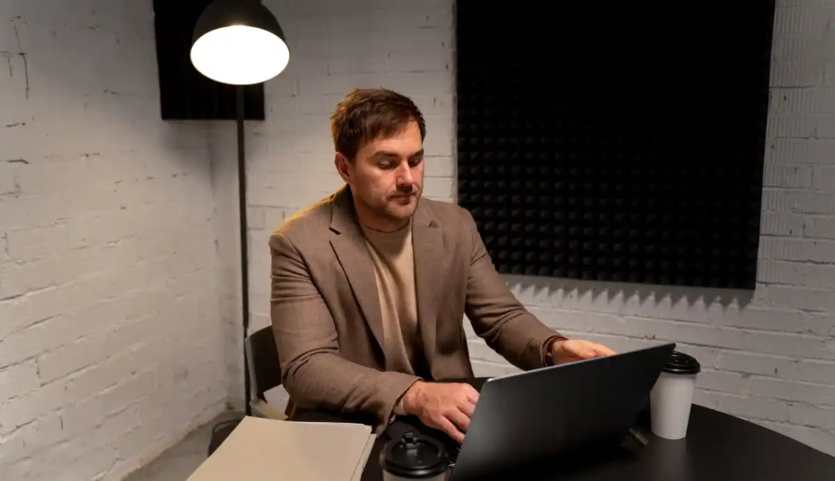 person focusing on laptop productivity