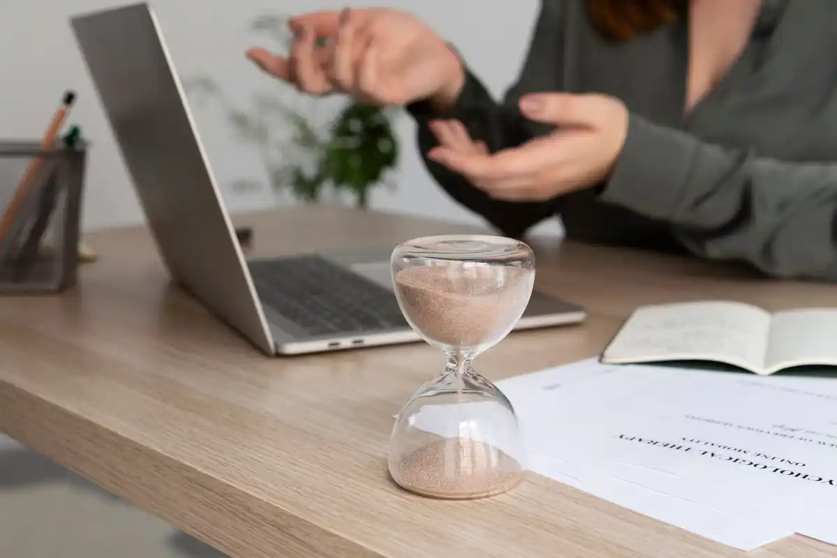focused person using timer on laptop