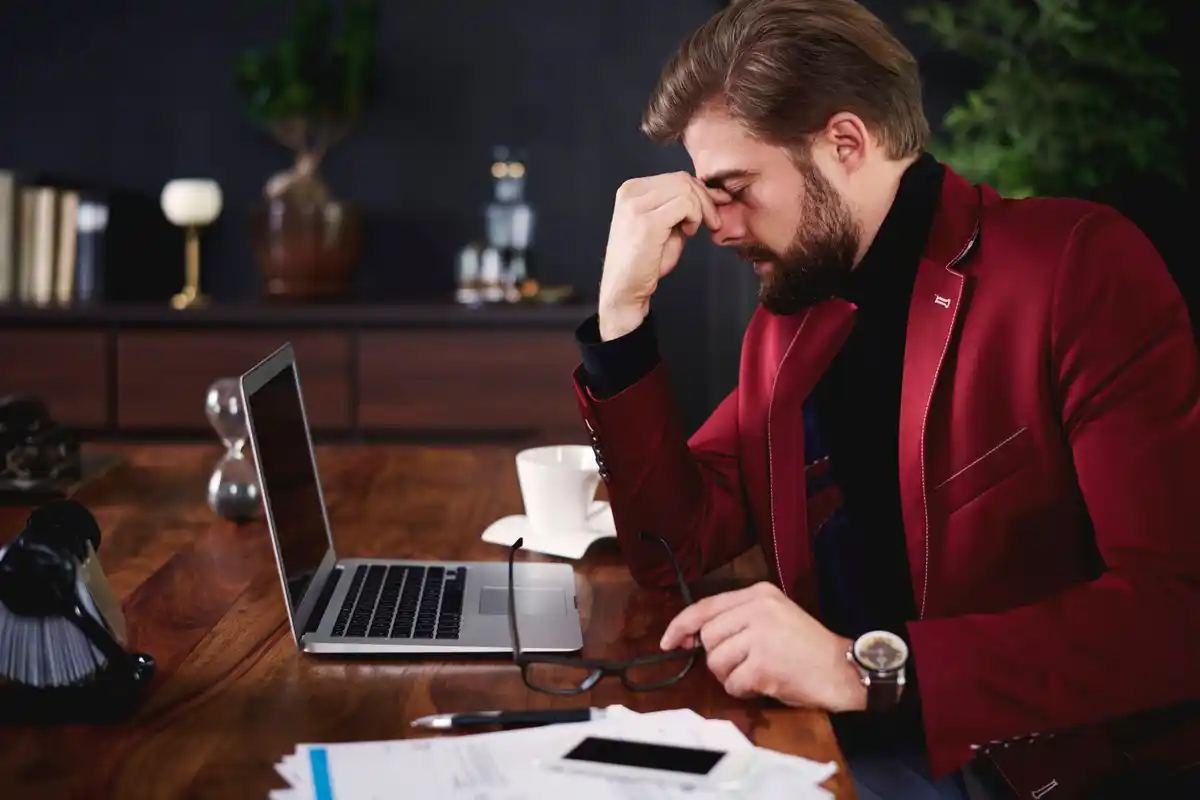 focused person working laptop time management
