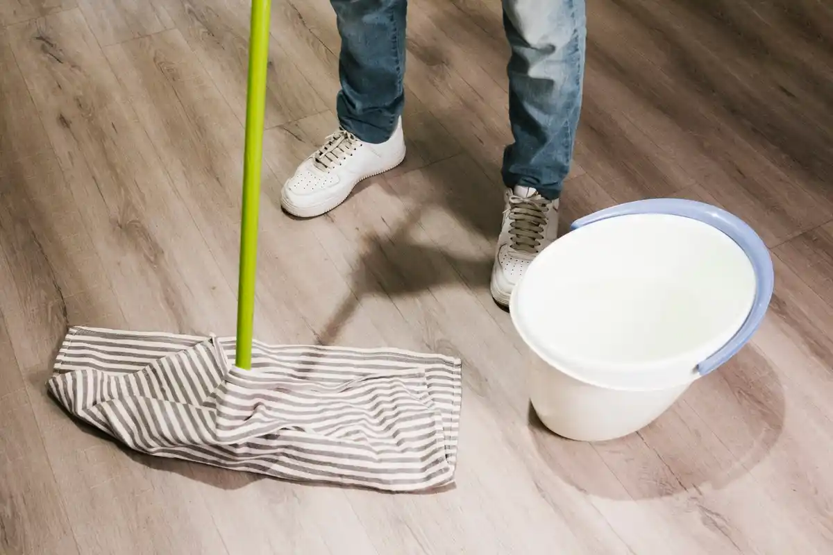 cleaning wooden floor with mop and microfiber cloth Netherlands