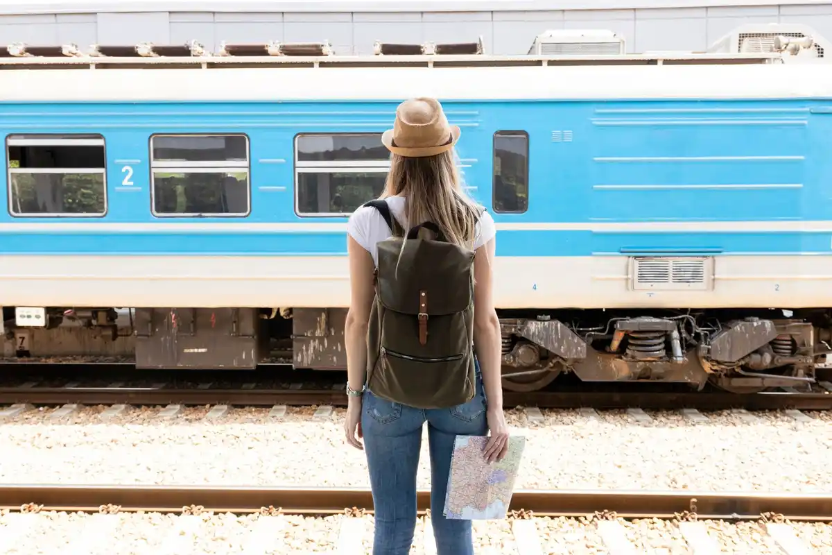 Dutch regional airport traveler luggage train trip