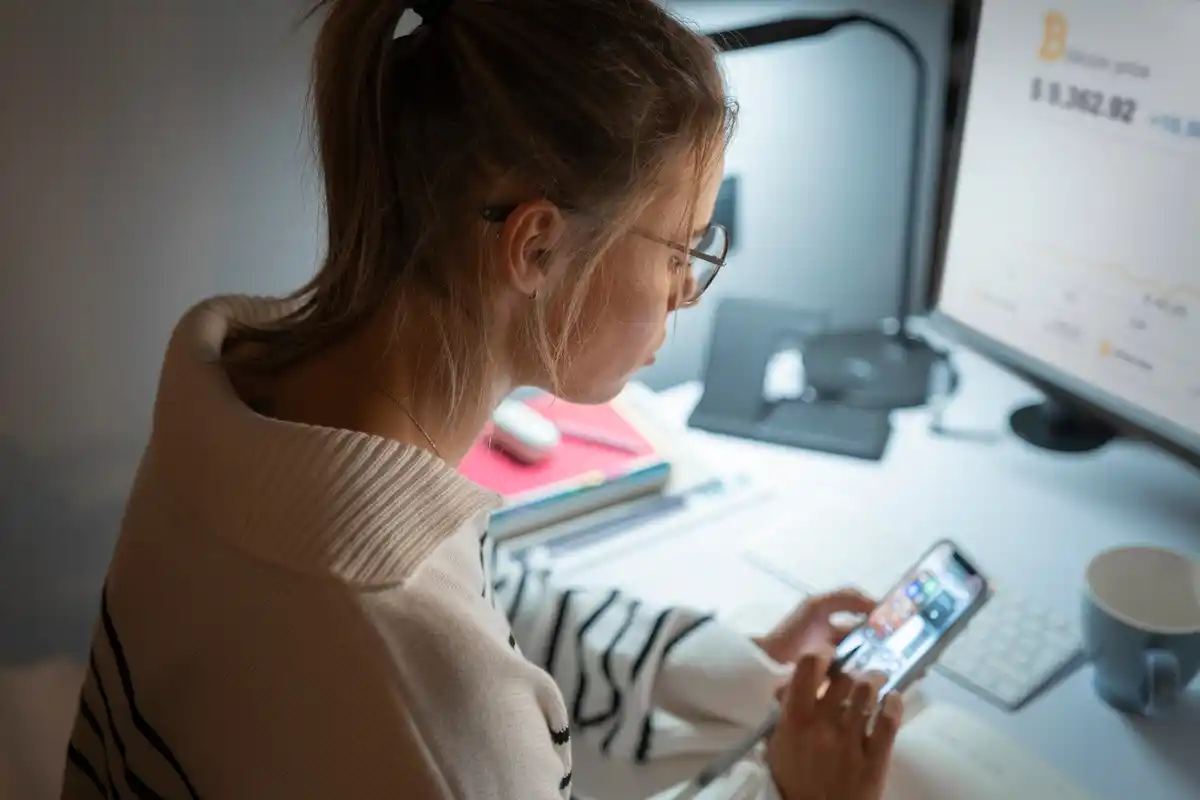 person organizing smartphone apps for productivity
