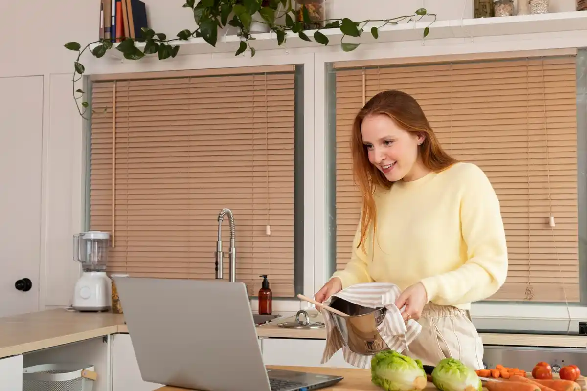 focused person using kitchen timer at desk